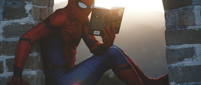 spiderman reading a book