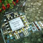 Banksy-style Street Artist has taken to Tiling Potholes pothole filled with mosaic tile in France