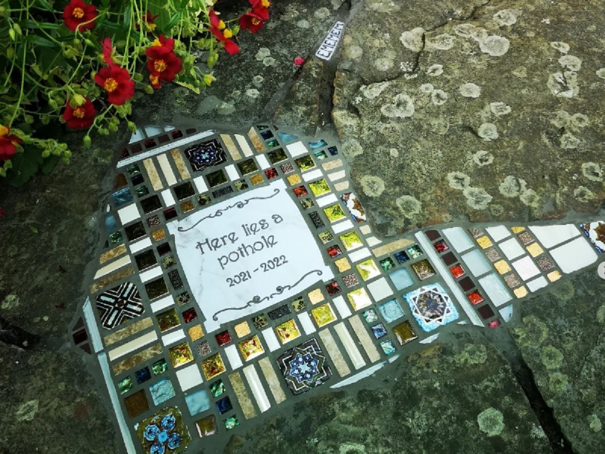 pothole filled with mosaic tiles