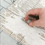 mosaic tile backing sticking to the surface